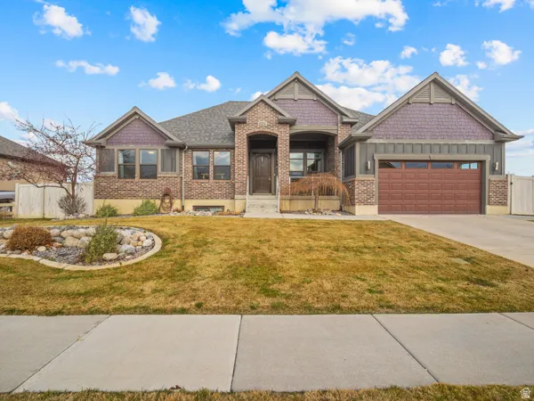 Craftsman-style home with brick and cement board exterior
