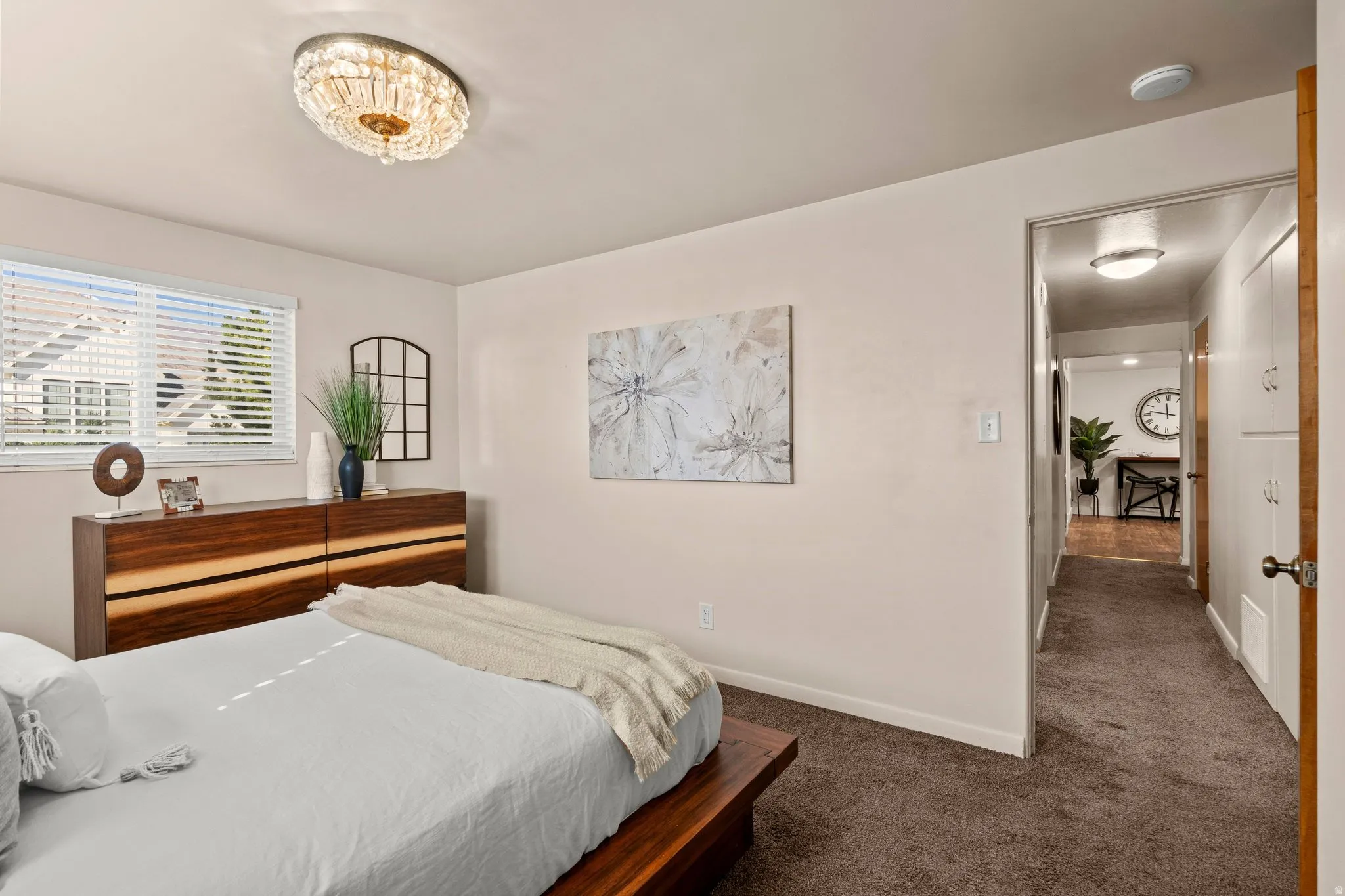 Bedroom with carpet flooring and baseboards