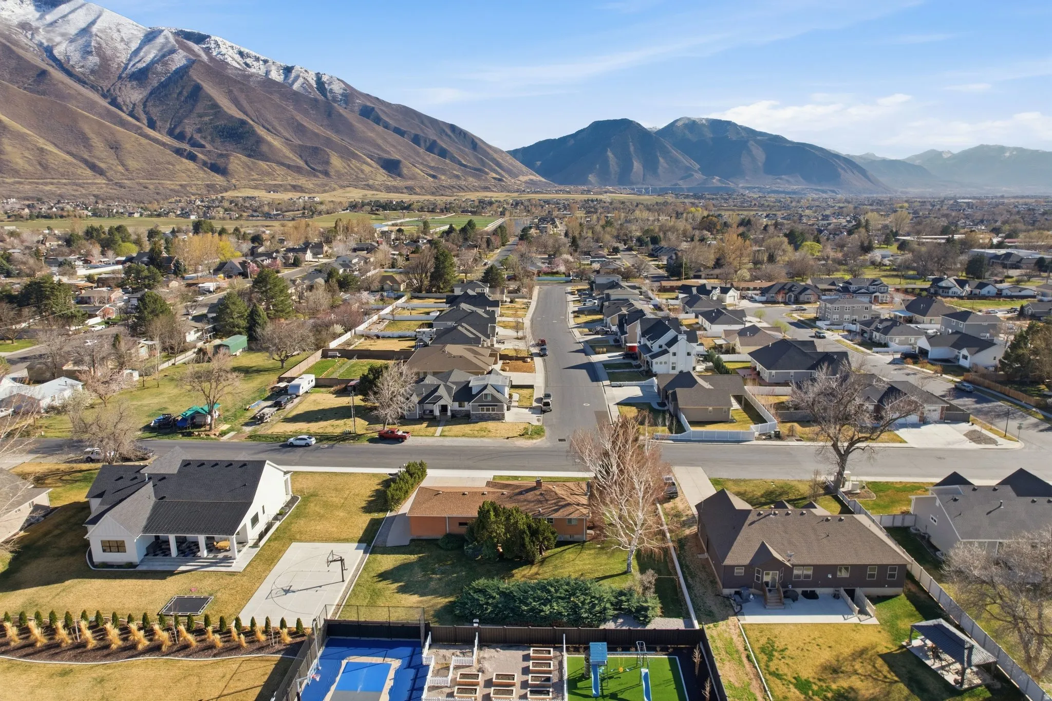 Aerial view of residential area featuring a mountain backdrop