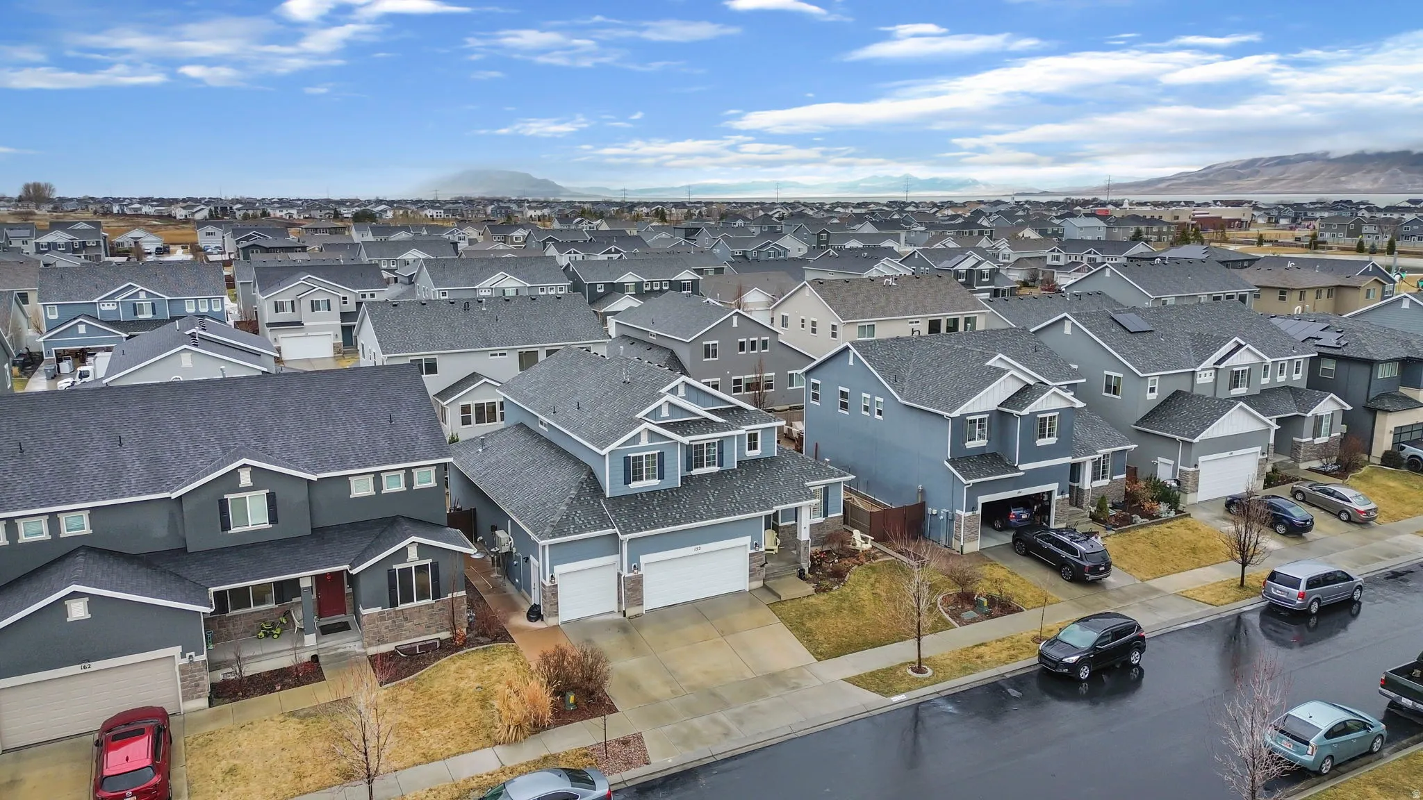 Aerial view of residential area featuring a mountain backdrop
