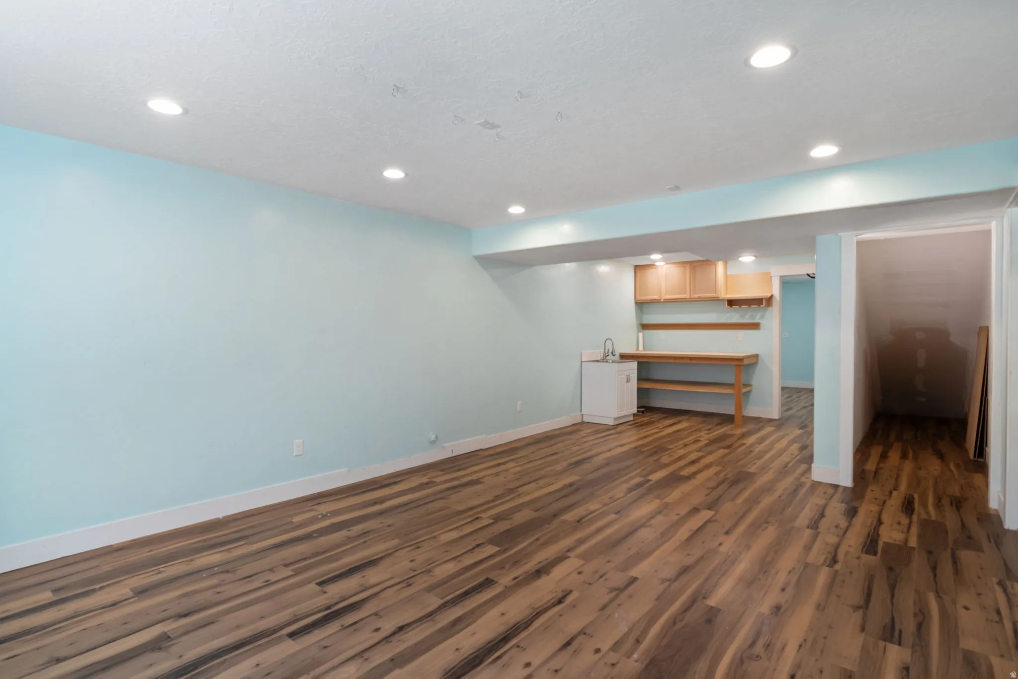 Spacious room featuring wood-finish flooring, recessed lighting. Could be finished as a 6th bedroom and additional bath.