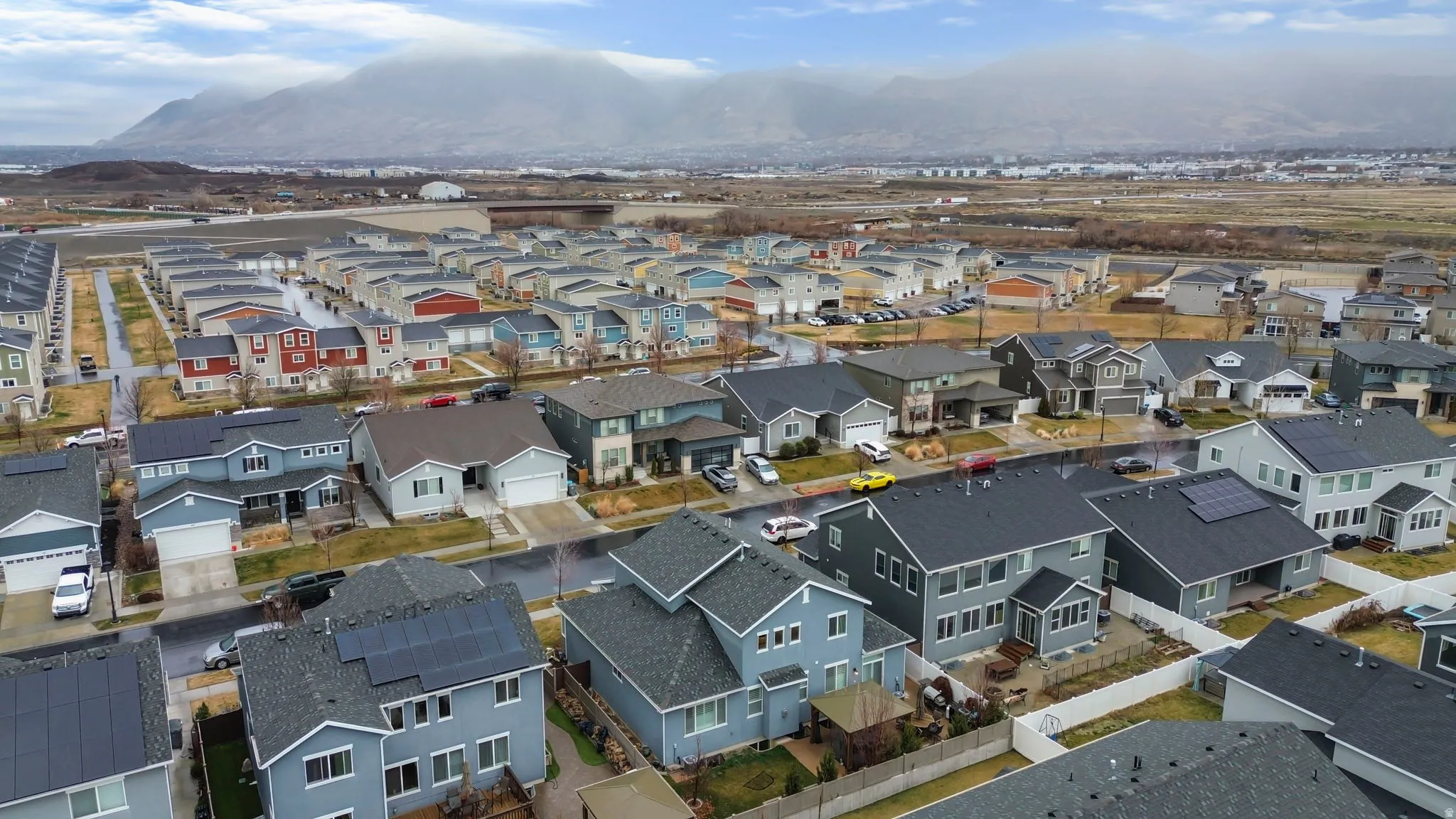 Aerial view of residential area with a mountainous background