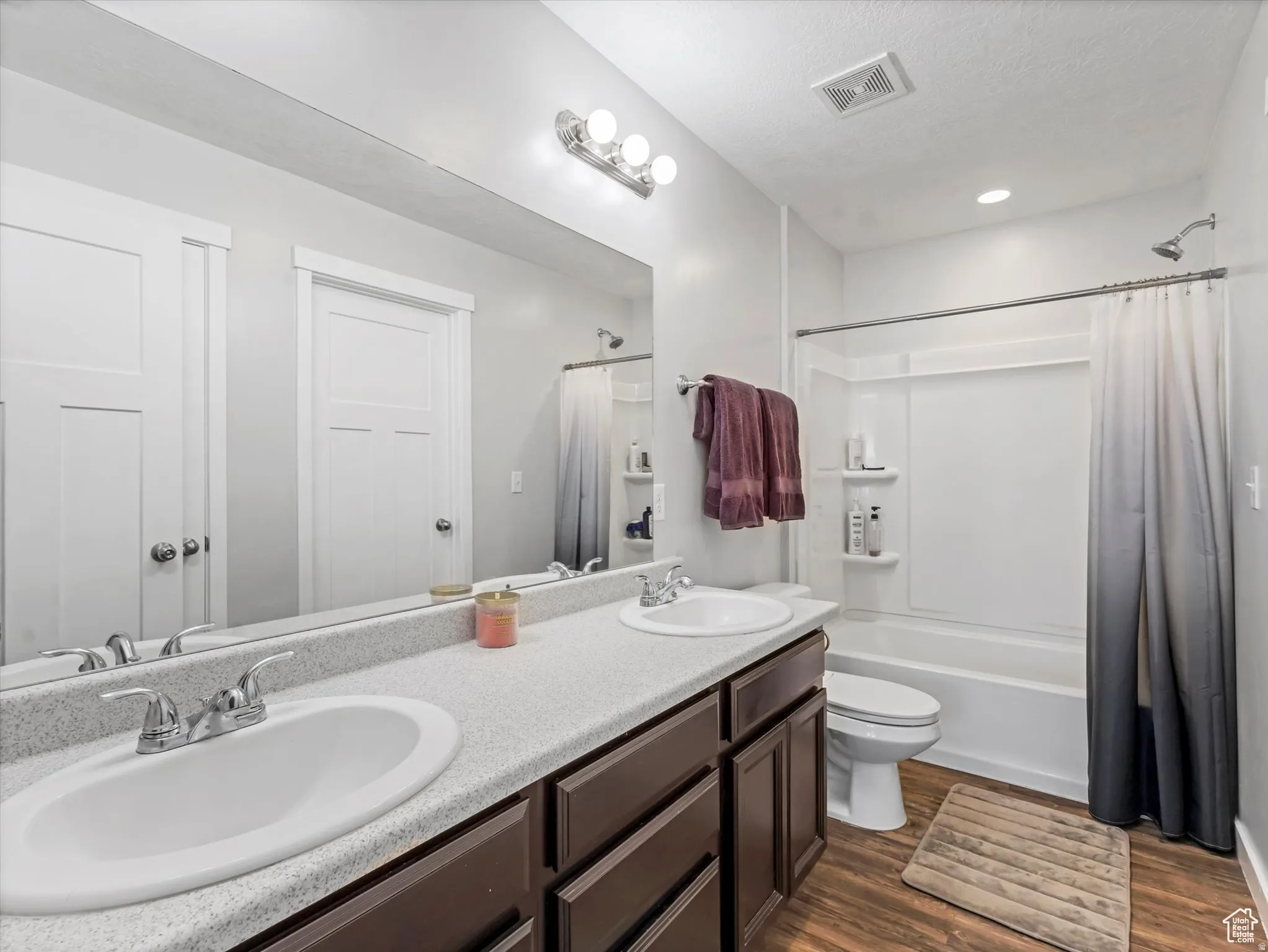 Primary Bathroom with Double Sinks and a Tub/Shower Combo