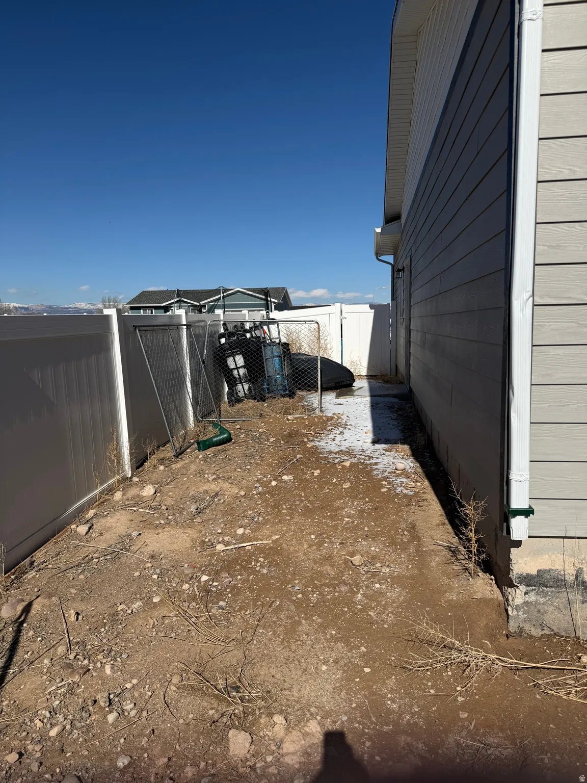 View of fenced backyard