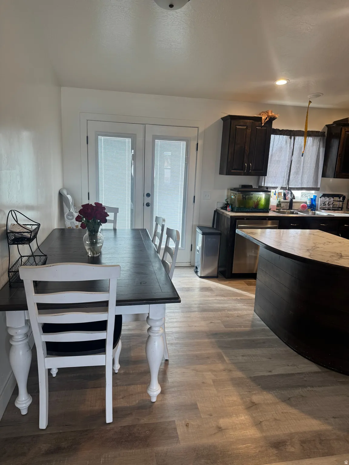 Dining space featuring french doors and light wood-style flooring