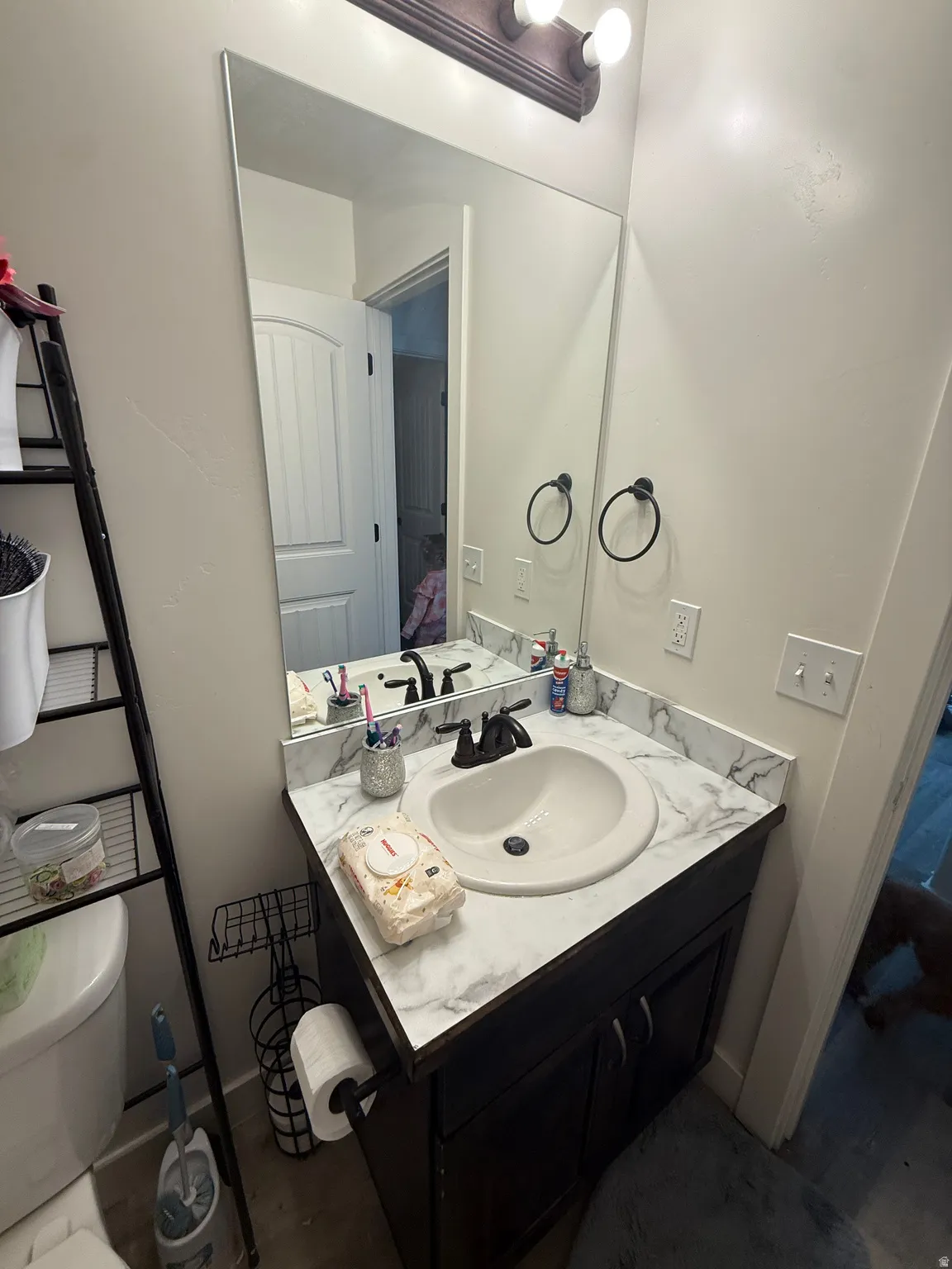 Half bath with vanity and toilet