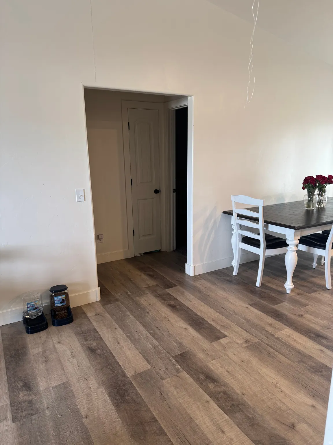 Dining room with wood finished floors and lofted ceiling