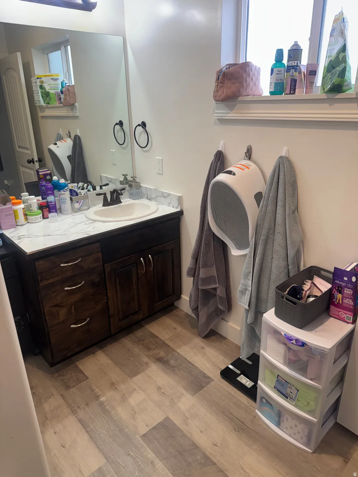 Bathroom with vanity and light wood-style floors