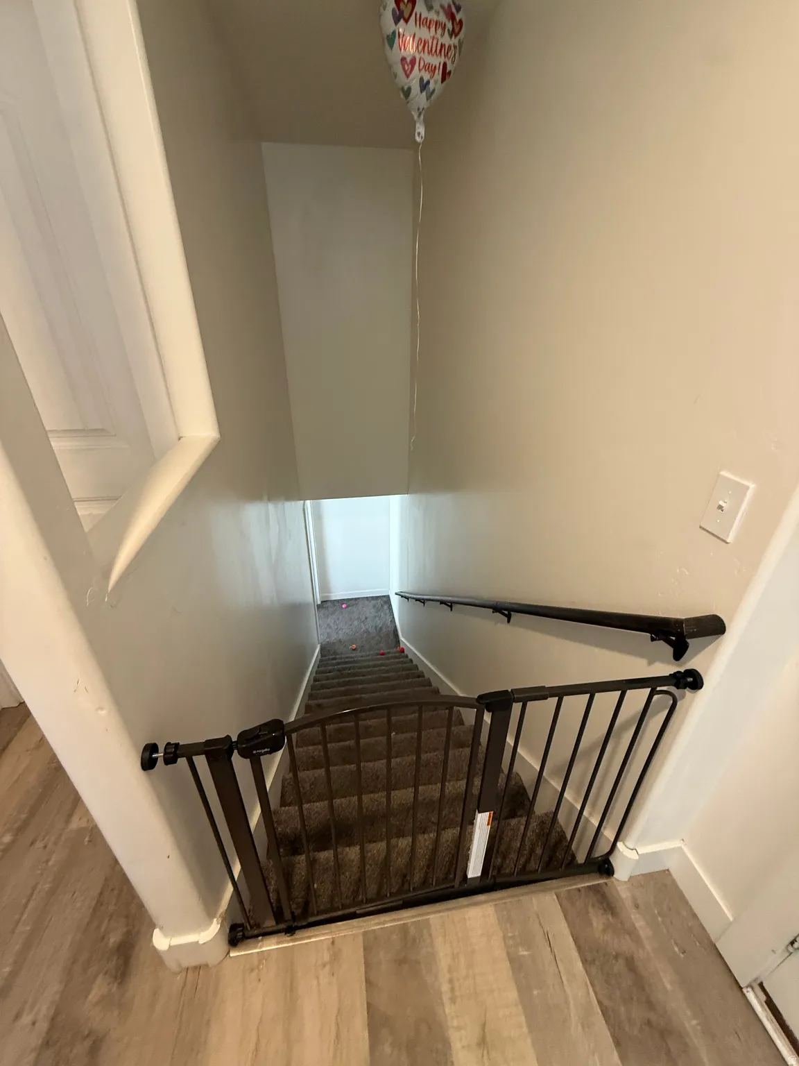 Staircase with wood finished floors