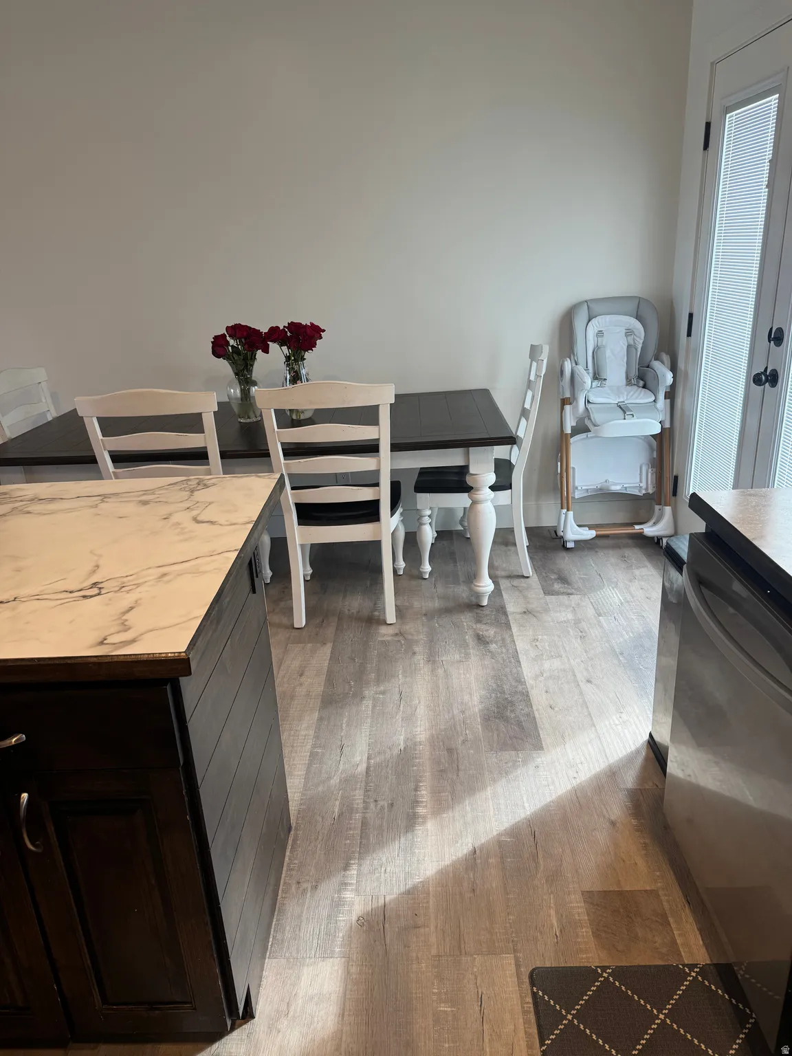 Dining area with light wood-style flooring