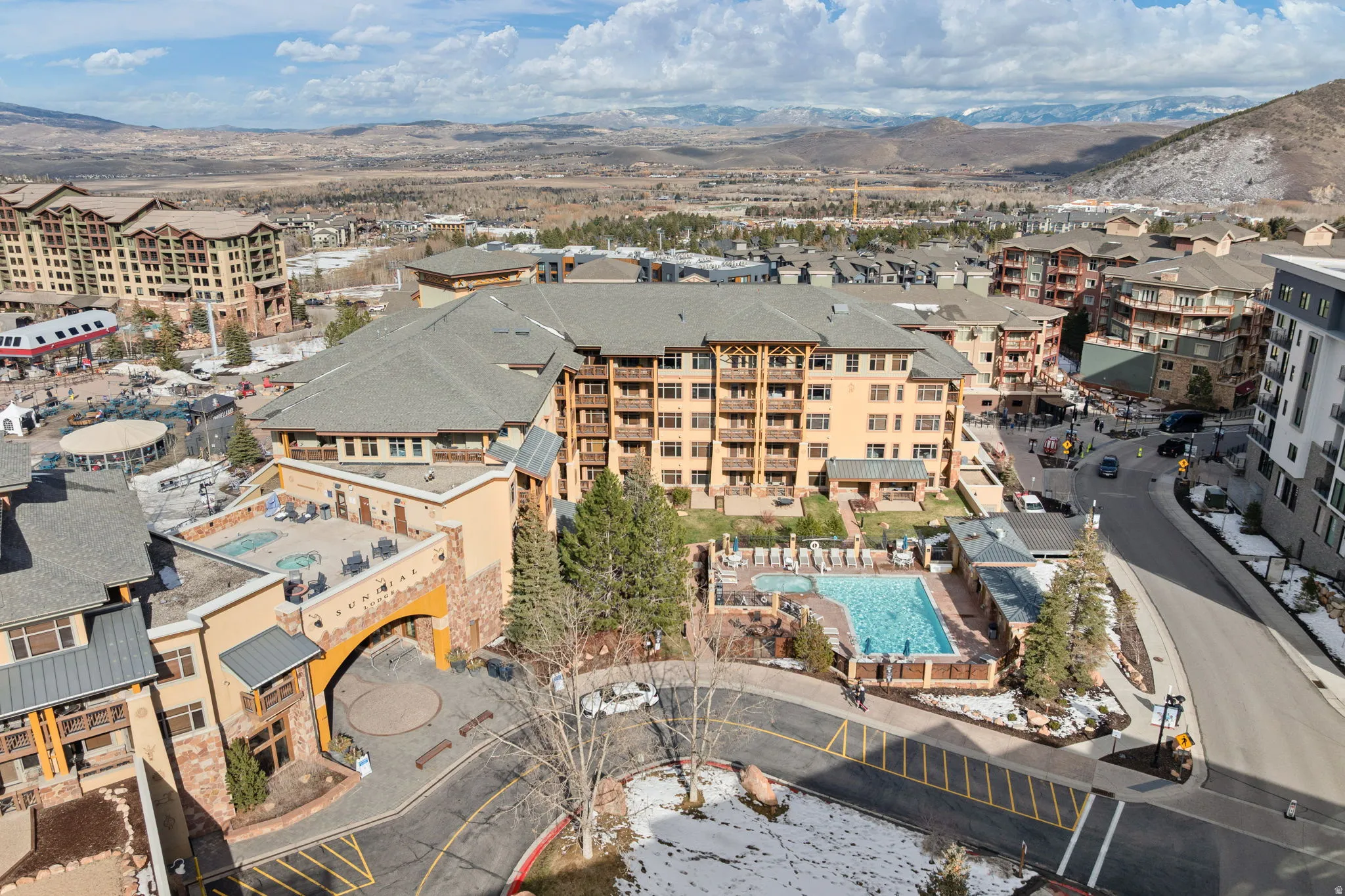 Aerial view of a mountainous background and a pool area