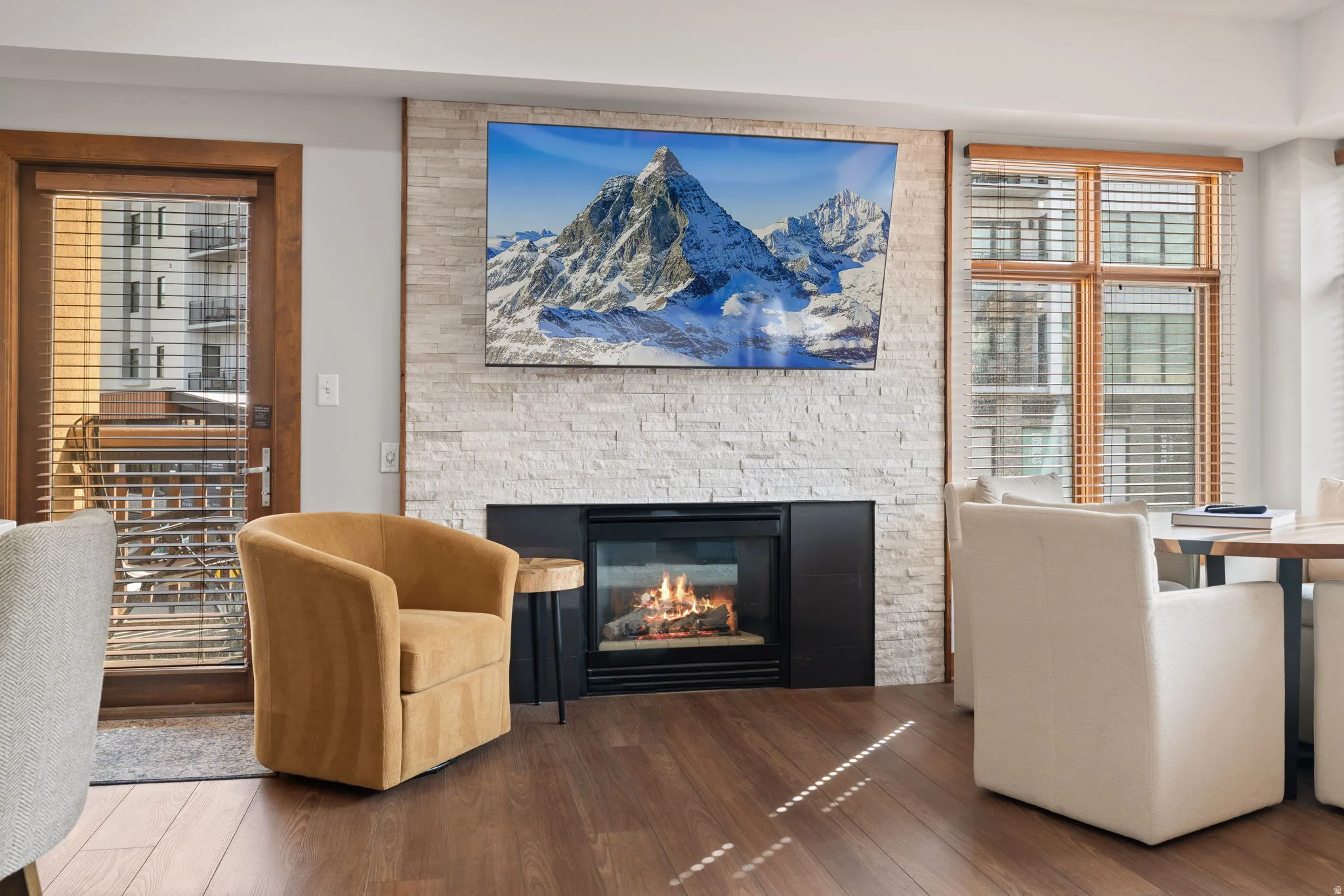 Living area with wood finished floors and a fireplace