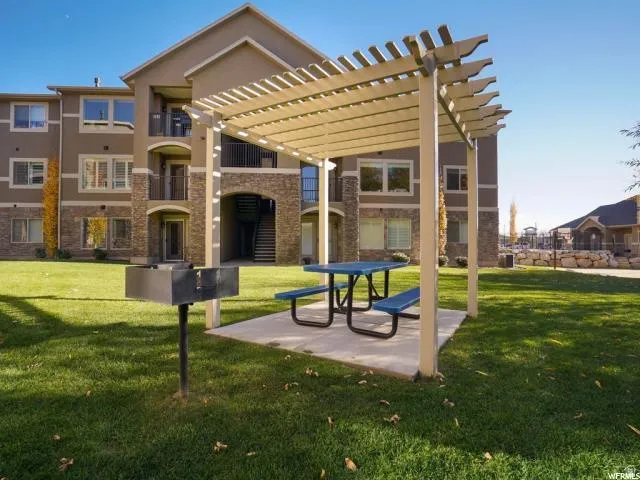 View of home's community featuring a pergola and a patio