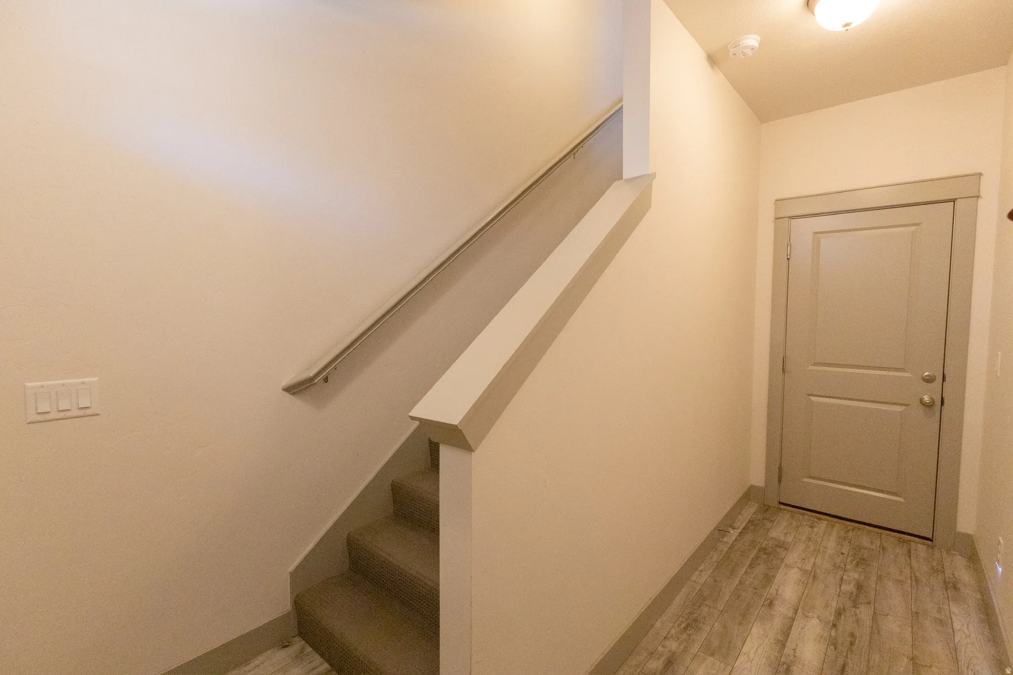 Stairway with wood finished floors