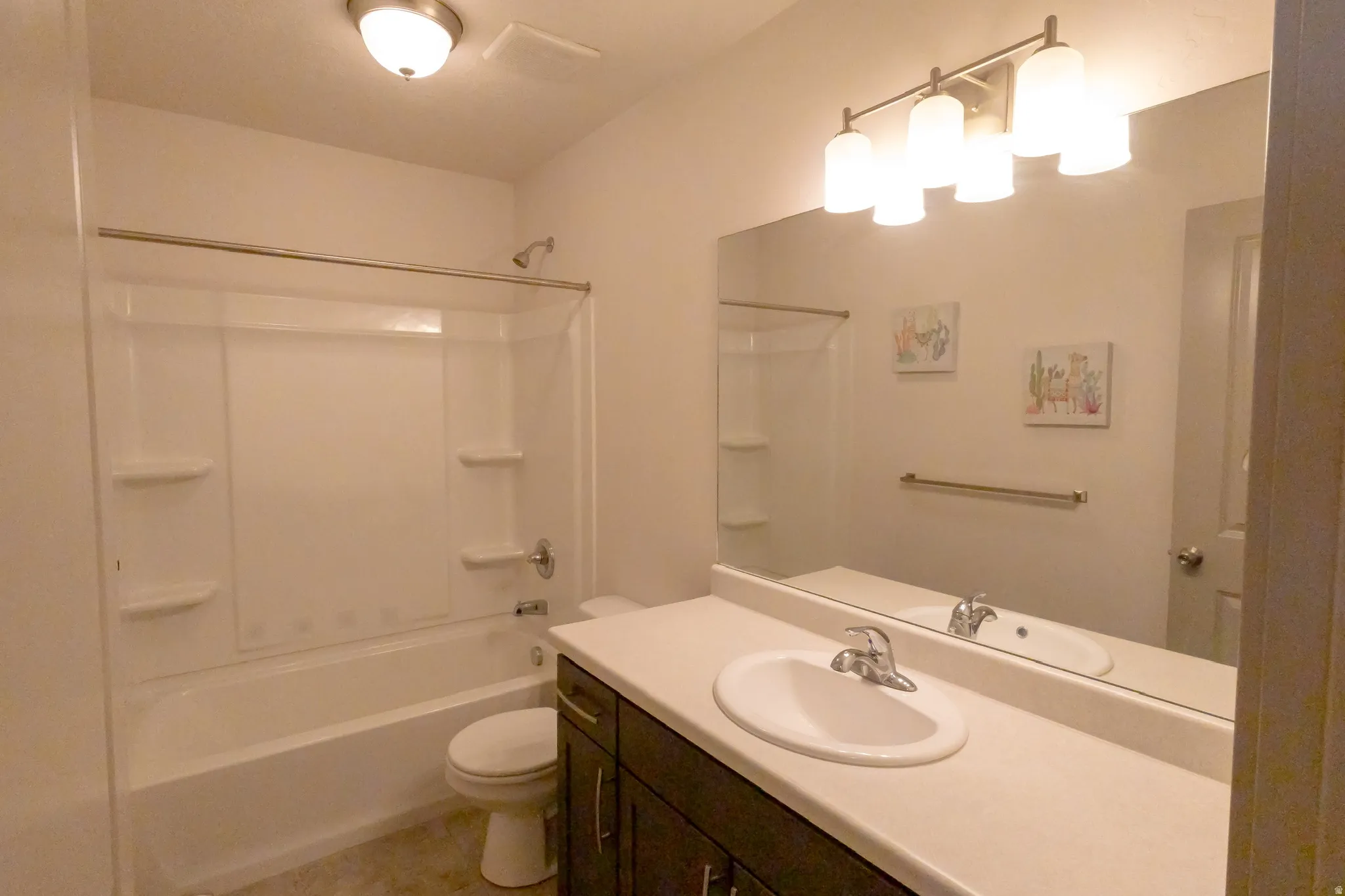 Full bathroom featuring vanity and shower / bath combination