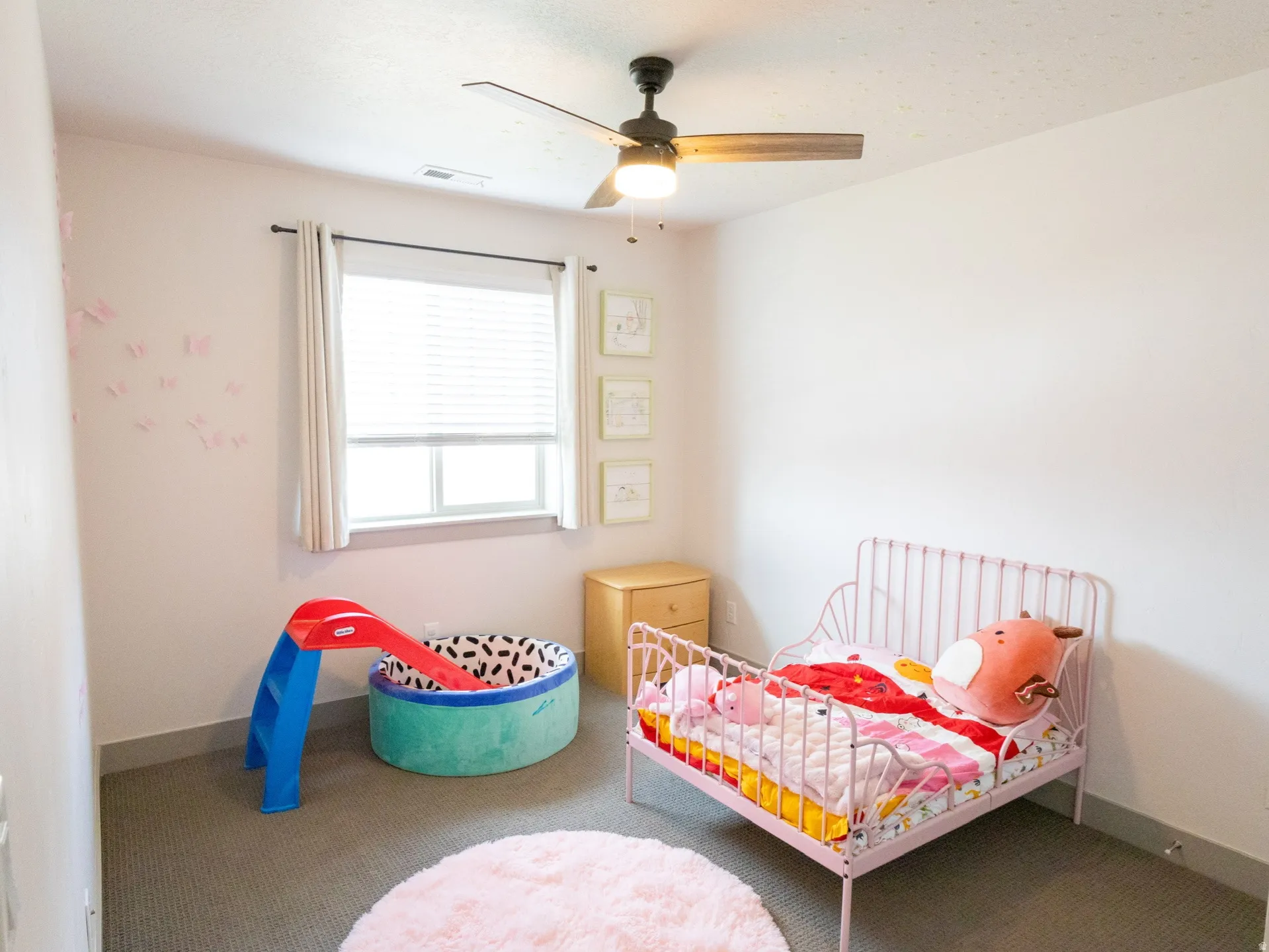 Bedroom featuring carpet and a ceiling fan