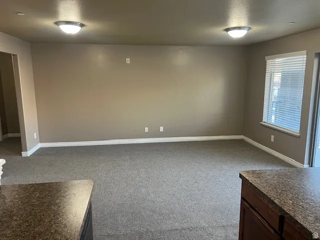 Spare room featuring light colored carpet