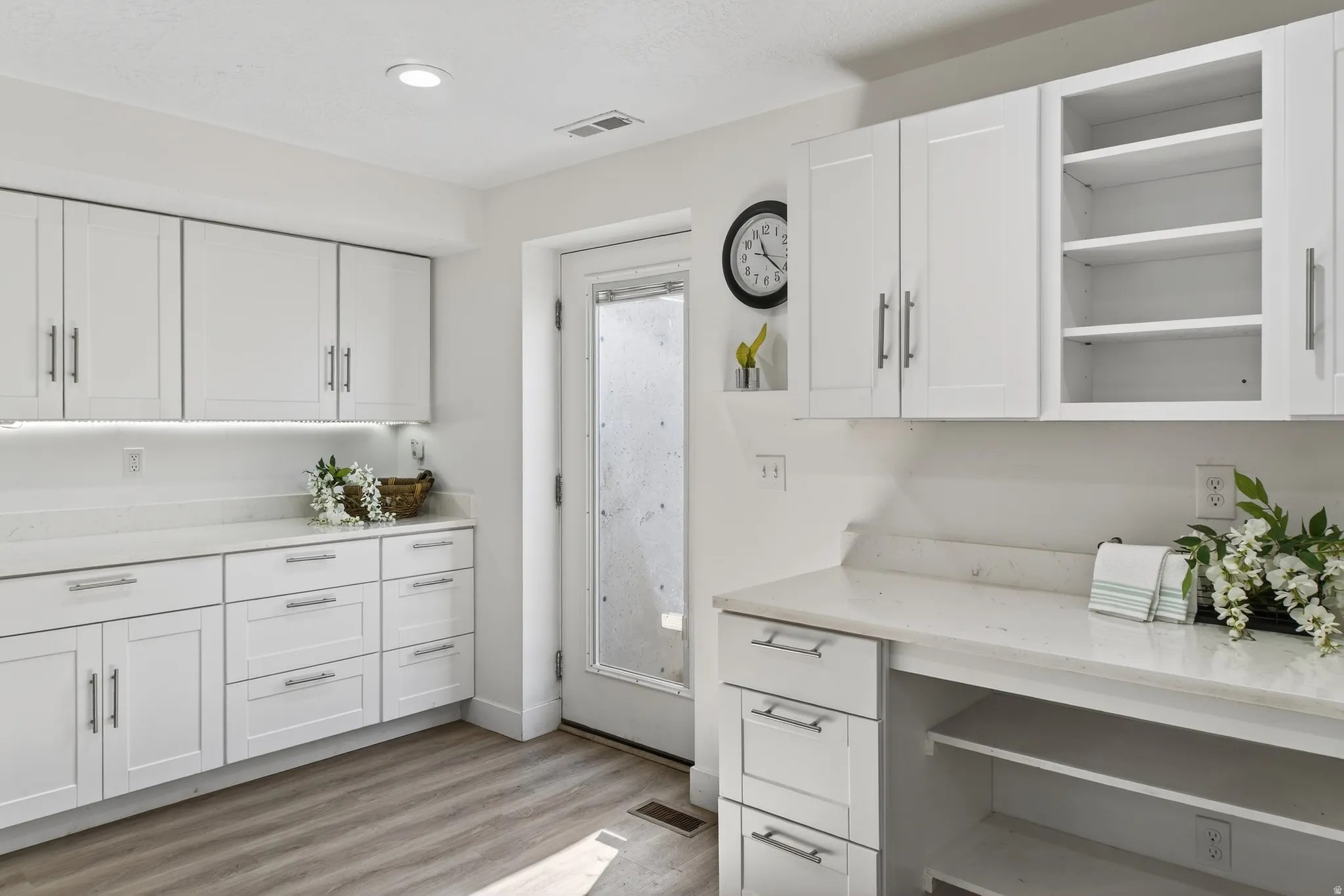 Basement Kitchen with open shelves, white cabinetry, and recessed lighting