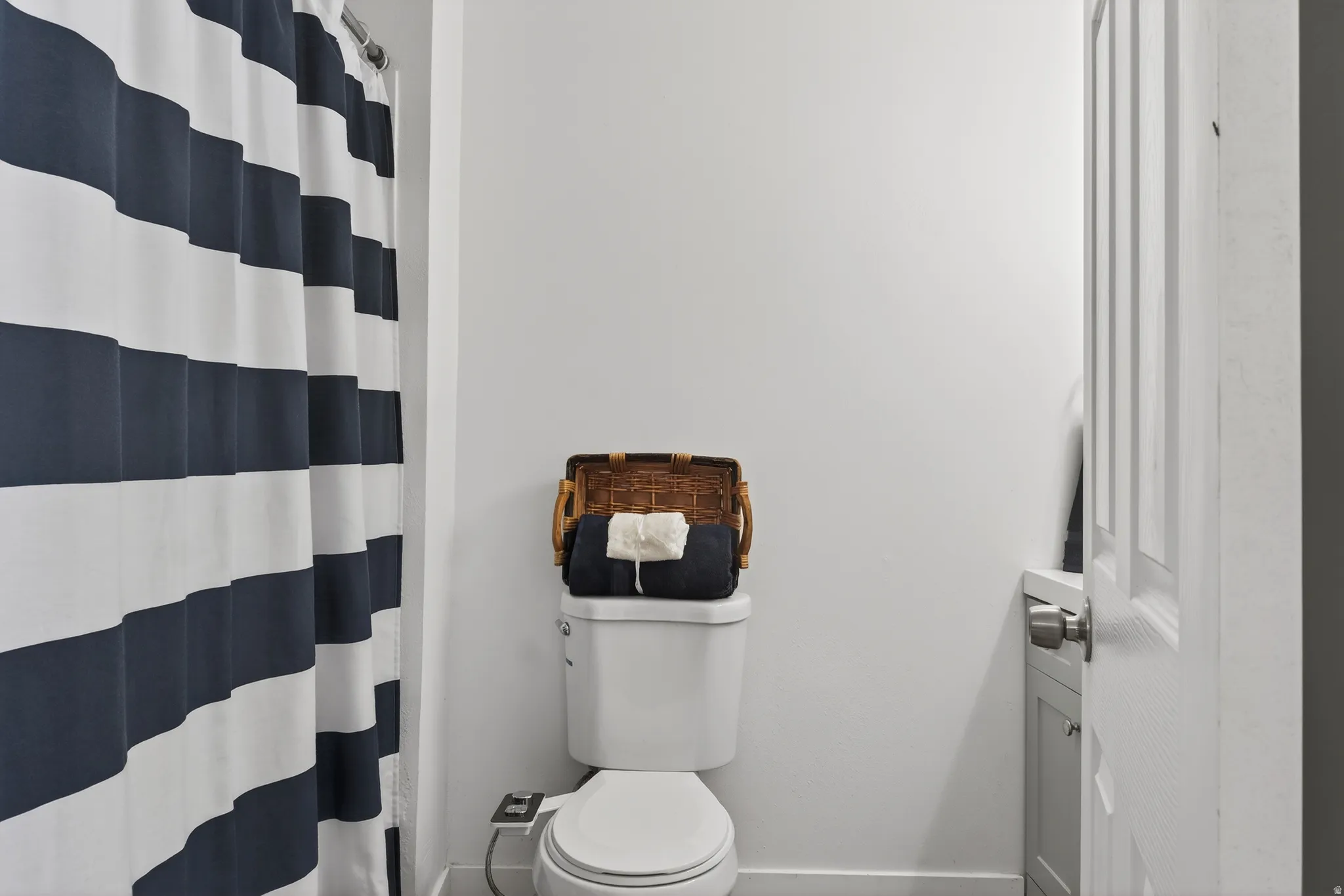 Full bath with a shower with curtain and vanity