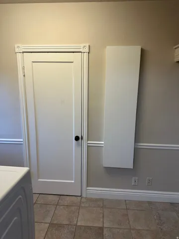 Bathroom featuring vanity and washer / dryer