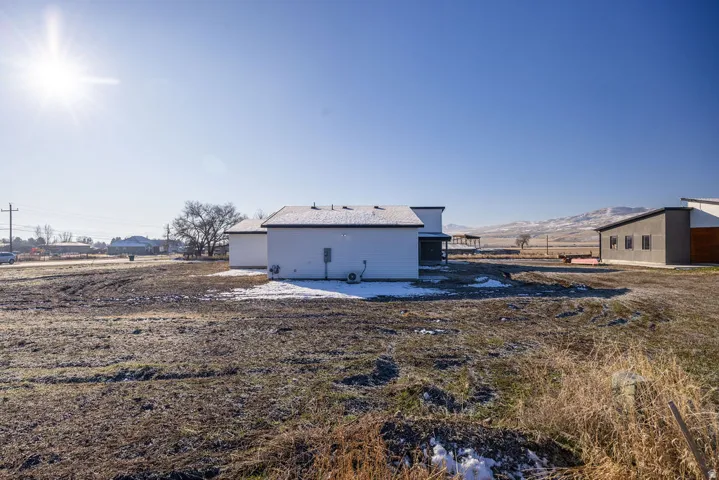 Back of house featuring a mountain view