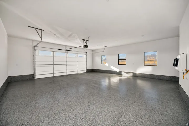 Garage featuring baseboards