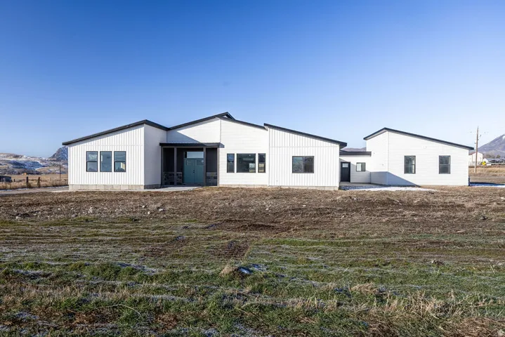 Back of property featuring a mountain view
