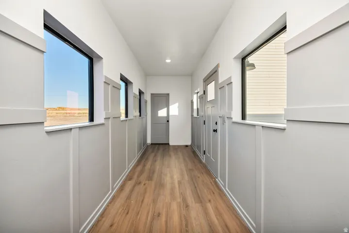 Hall featuring dark wood-style flooring
