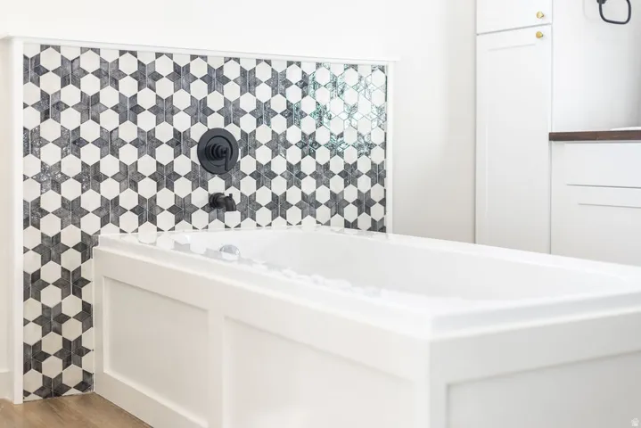 Full bath featuring a bath
