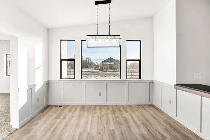 Unfurnished dining area with light wood finished floors