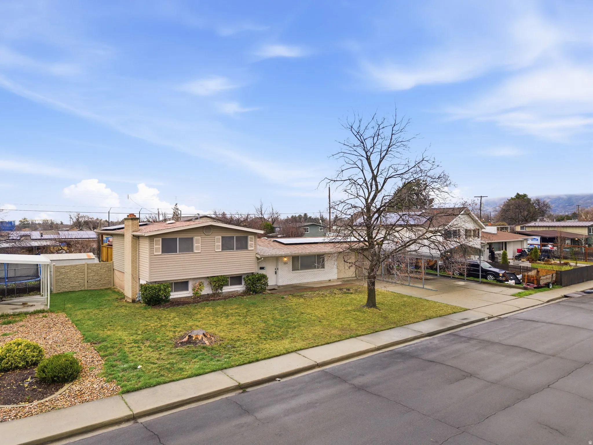 View of front of property with roof mounted solar panels