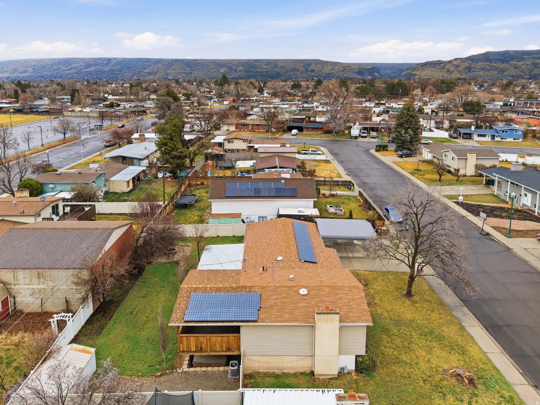 Aerial view of residential area with a mountain backdrop