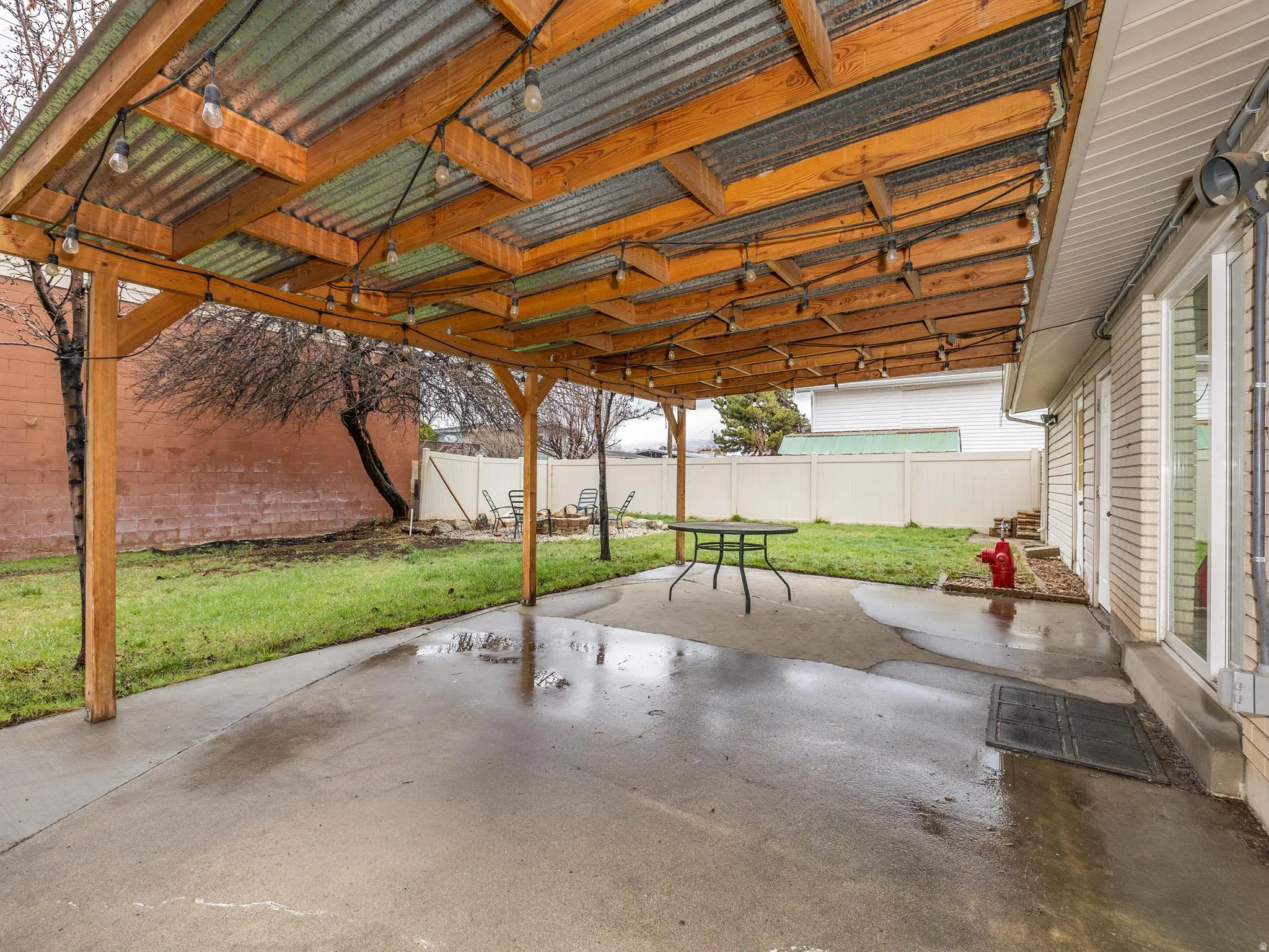 Fenced backyard featuring a patio area