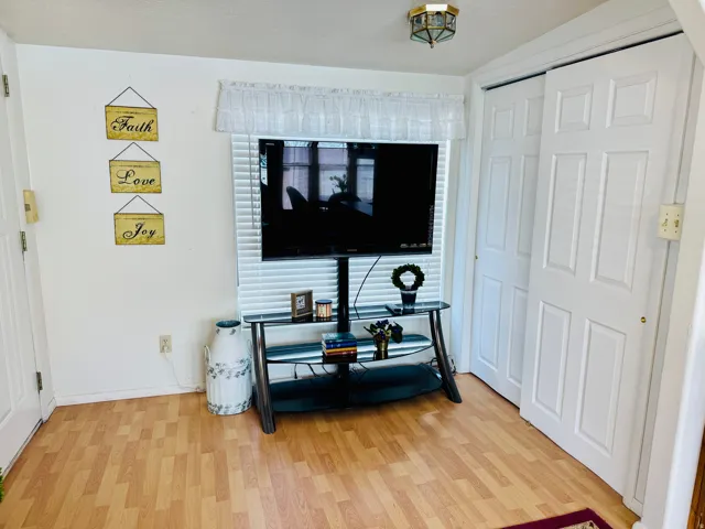 Interior space with wood finished floors and baseboards