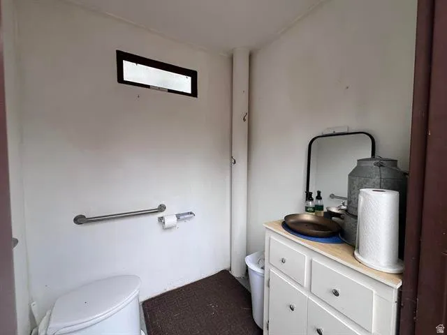 Bathroom featuring toilet and vanity