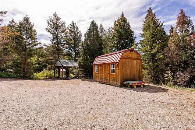 View of shed with view of scattered trees