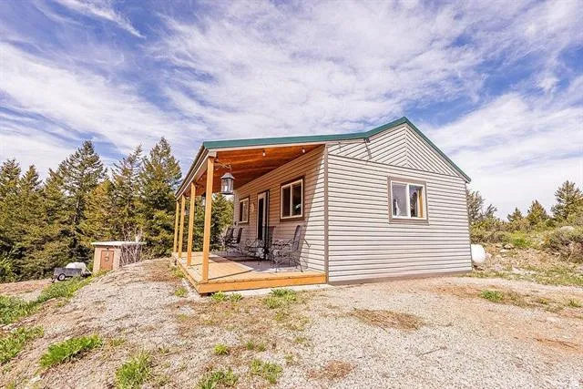 View of property exterior featuring a deck