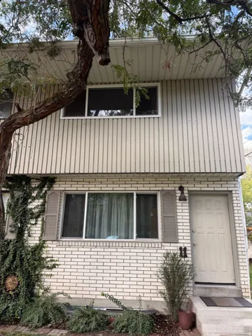 View of side of property with brick siding
