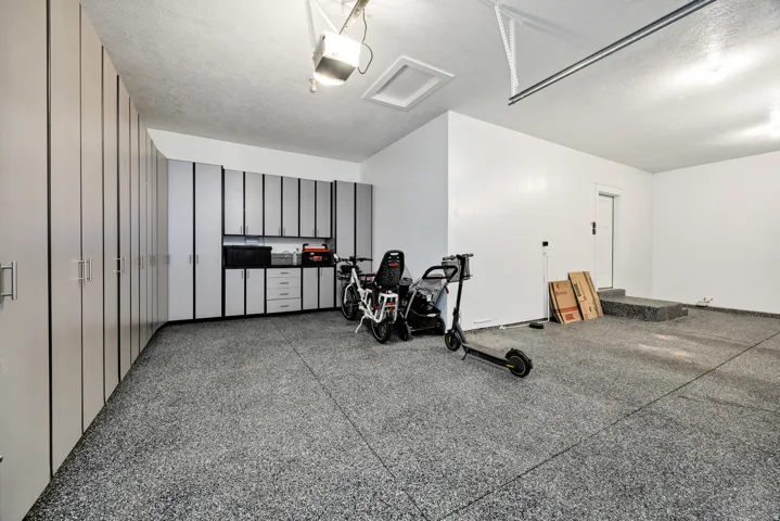 Garage featuring a garage door opener