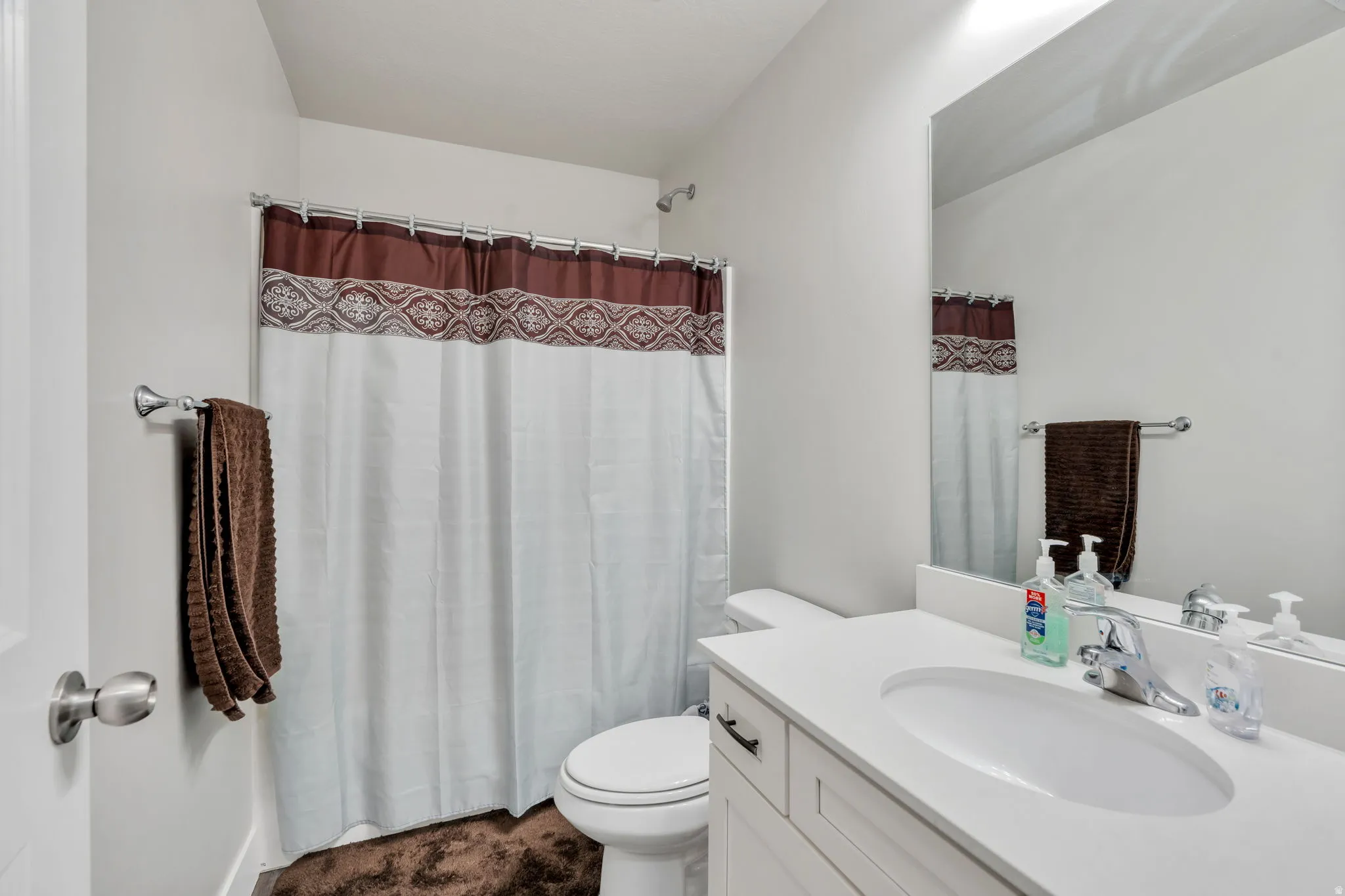 Bathroom featuring vanity and a shower with shower curtain