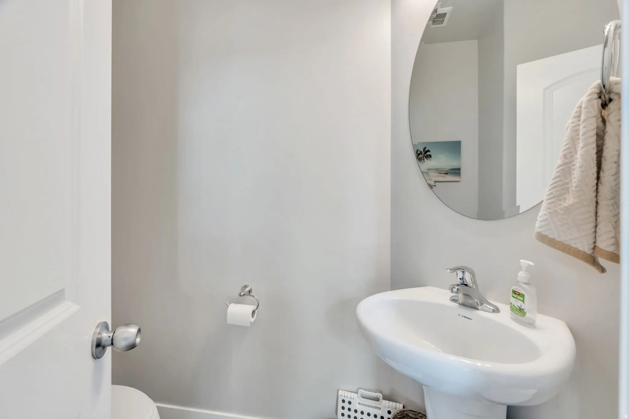 Bathroom featuring toilet and a sink