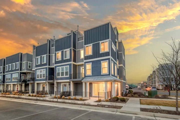 View of property at dusk