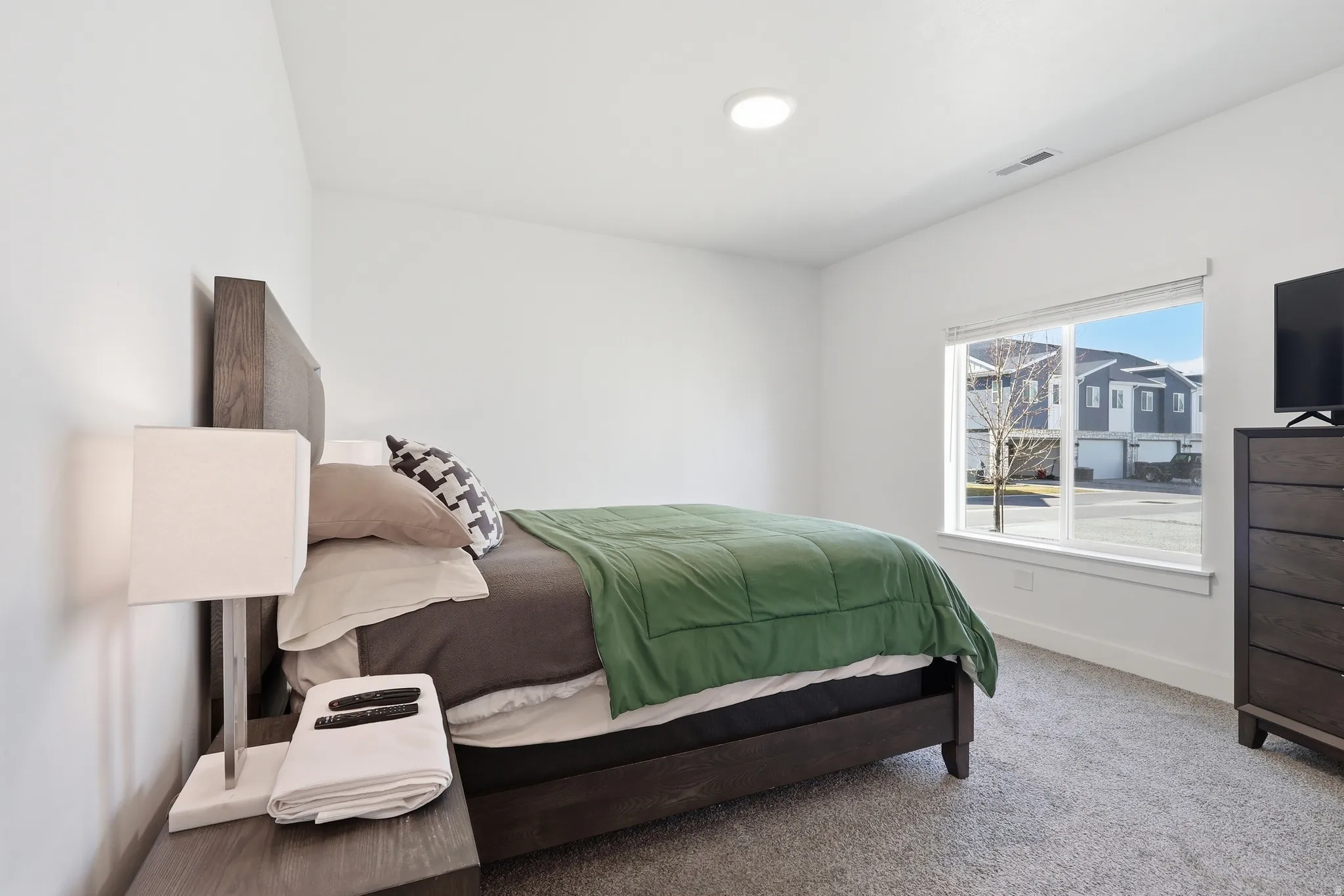 Primary Bedroom with carpet floors and baseboards
