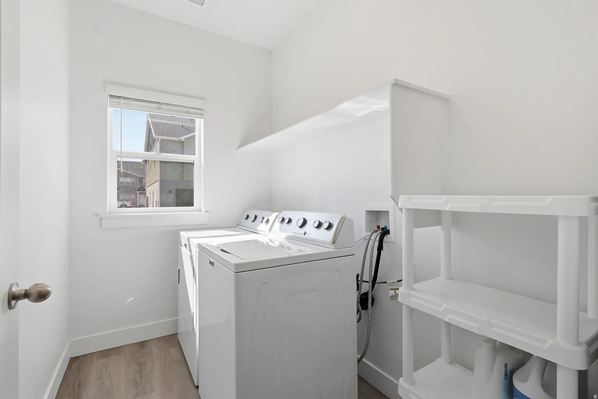 Laundry room with shelving