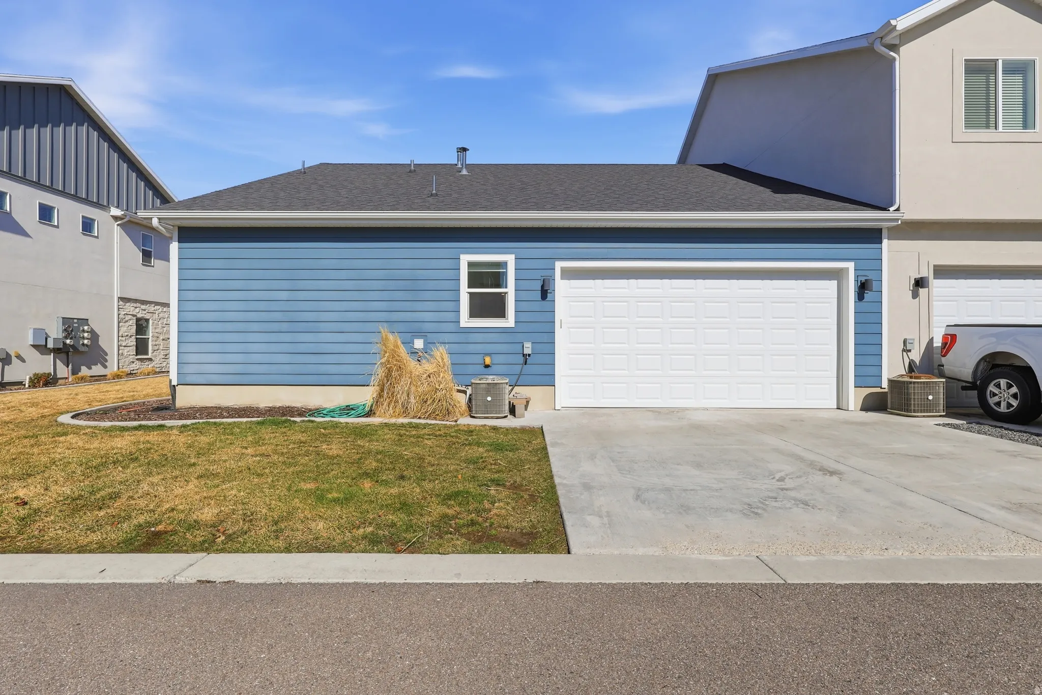 View of concrete driveway and garage,