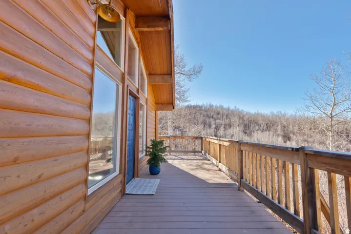 View of wooden deck (which wraps all the way around to the west side).
