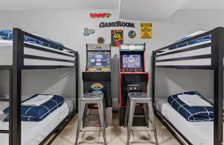 Bedroom featuring light carpet
