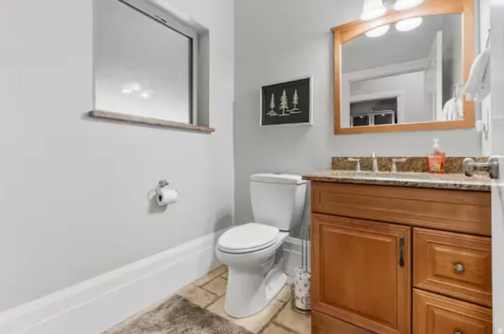 Bathroom with toilet and vanity