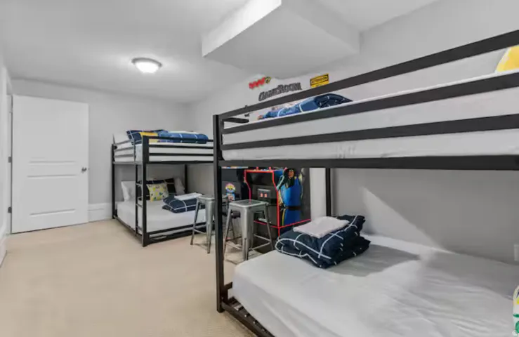 Bedroom featuring light carpet