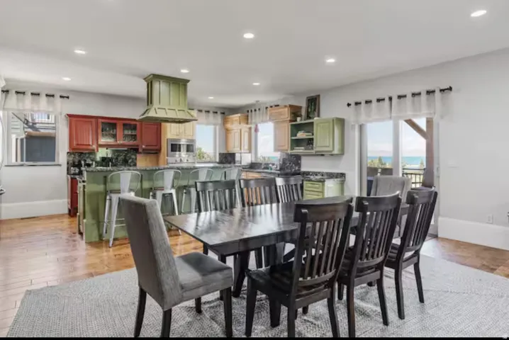 Dining area featuring light wood-style flooring and recessed lighting